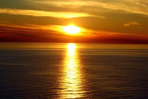 The sunset at the sea Stock Photos