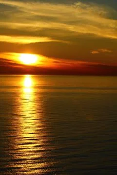 The sunset at the sea Stock Photos