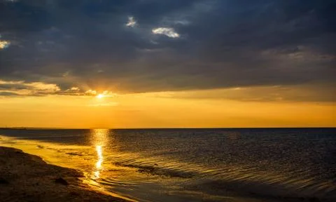 Sunset on sea Stock Photos