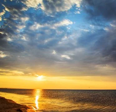 Sunset on sea Stock Photos