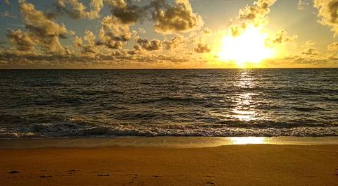 Sunset by the sea Stock Photos