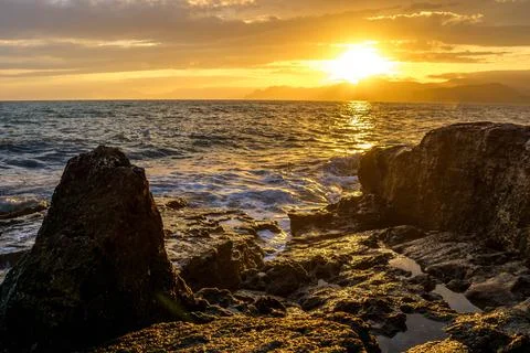 Sunset by the sea Stock Photos