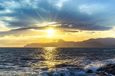 Sunset by the sea Stock Photos