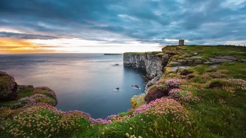 Sunset with Sea Pinks from Kitchener's Memorial in Marwick Orkney HD Time Lapse Stock-Footage 256084182