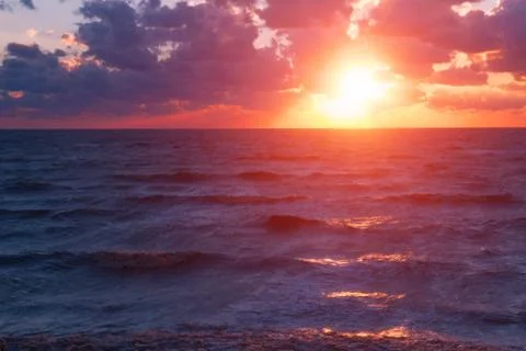 Sunset sea rays Stock Photos