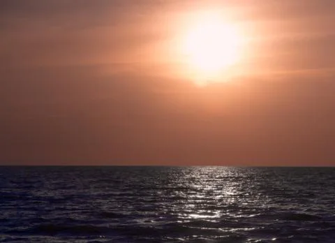 Sunset sea reflections Stock Photos