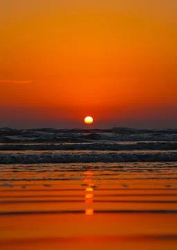 Sunset into the sea. Selective focus. Shallow depth of field. Background blur Stock-Fotos