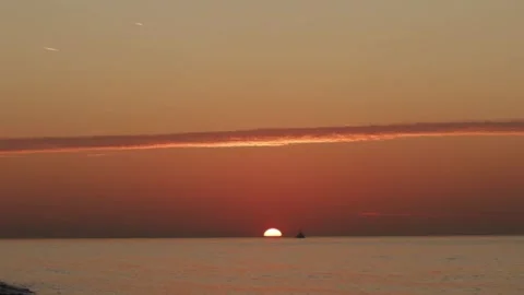 Sunset at sea with a ship, ocean backdrop and scenic waves, golden hour cre.. Stock Footage 301949128