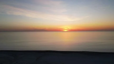 Sunset in the sea shot in timelapse mode from a quadrocopter Stock Footage 238894688