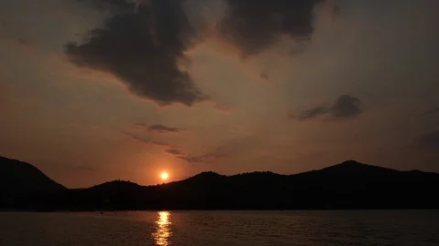 Sunset on the sea with silhouette mountain range. Stock Footage 123143641