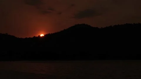 Sunset on the sea with silhouette mountain range. Stock Footage 131448331