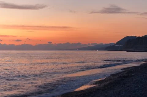 Sunset at sea small waves Stock Photos