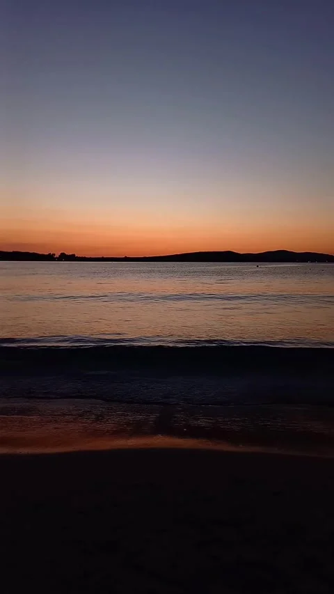 Sunset on sea in summer. Sandy beach, calm. Stock Footage 279347173