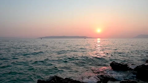 Sunset at the sea in summer. Soft waves on the water. Stock Footage 248902320