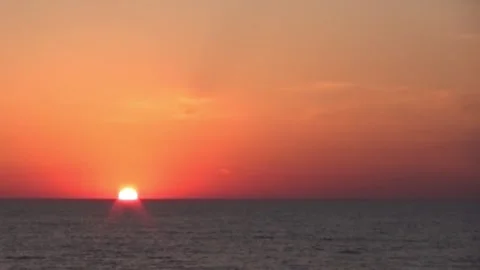 Sunset at sea, timelapse, no clouds, red sun Stock Footage 290955477