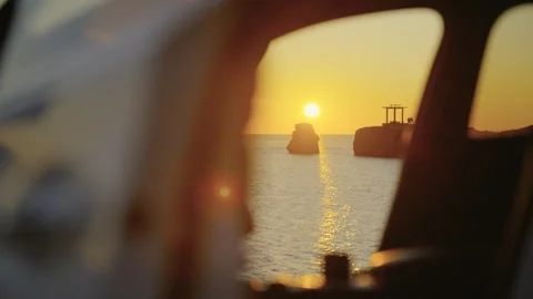 The sunset sea view outside the car window Stock Footage 313946902