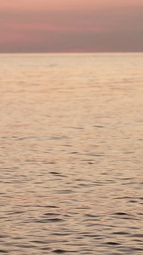 Sunset on the sea with waves and reflection in the water Video stock 297030472
