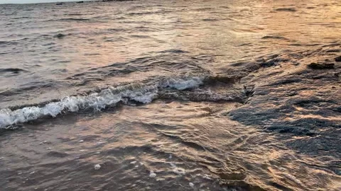Sunset sea - waves on the rocks Stock Footage