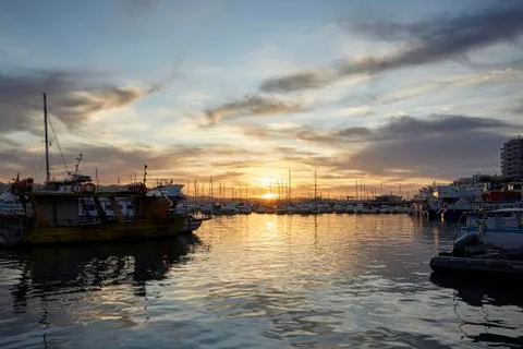 Sunset in a seaport Stock Photos