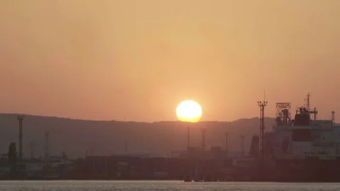 Sunset at seapost Timelapse. Cargo ships and cranes in seaport on sunset video Stock Footage 82227872
