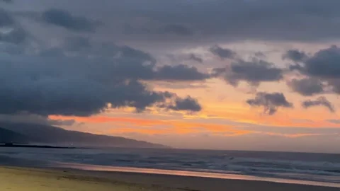 Sunset seascape capturing the raw power of ocean waves crashing onto the shore Stock Footage 330983236