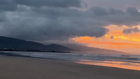 Sunset seascape capturing the raw power of ocean waves crashing onto the shore Stock Footage 330996546