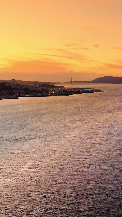 Sunset seascape with distant Golden Gate Bridge, San Francisco, California Stock Footage 345791293