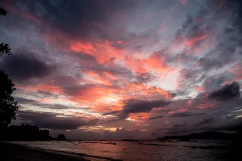 Sunset seascape with dramatic sky and colorful clouds Stock Photos