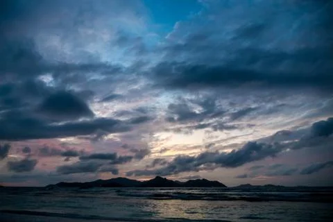 Sunset seascape with dramatic sky and stormy clouds Stock Photos