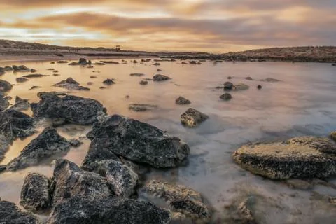 Sunset seascapes with rocks Stock Photos