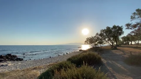 Sunset at Seaside Beach with Trees in Summer, Agokiri, Naxos, Greece Stock Footage 339677280