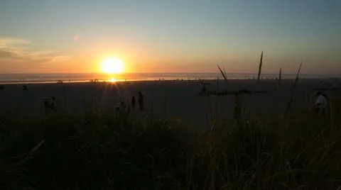 Sunset In Seaside Oregon With People Moving Around On The Beach HD Timelapse Stock Footage 18185960