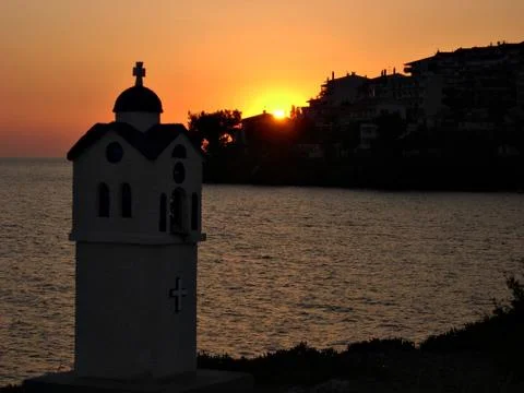 Sunset in a seaside town Stock Photos