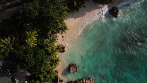 Sunset in secluded paradise beach of La Digue, Seychelles. Aerial Stock-Footage 342813162