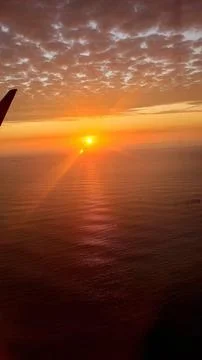 Sunset seen from an airplane window Foto stock