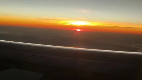 Sunset Seen from Airplane with Wing in Foreground (15 Sept 2026) Stock-Footage 345587445