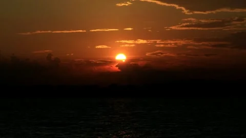 Sunset seen in the middle of the sea from the ship Video stock 280954757