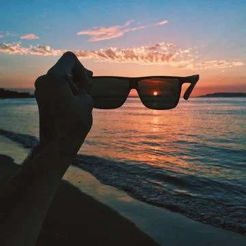 Sunset seen through black glasses Stock Photos