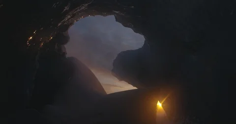Sunset seen through the rocky cave Video stock 103811251
