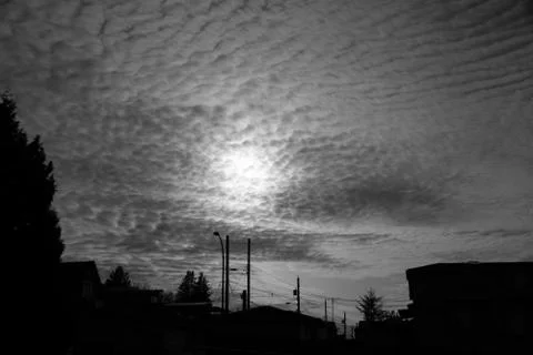The sunset seen through some clouds. Stock Photos