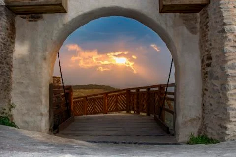Sunset seen thru gate Stock Photos