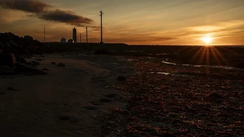 Sunset in Seltjarnarnes lighthouse, Iceland Stock Footage 122402178