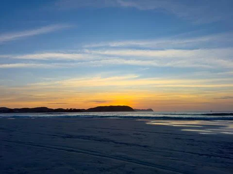 Sunset on the serene beach Stock Photos
