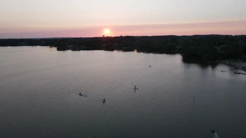 Sunset Serenity: Drone Captures Stunning Views of Sunset Beach in Toronto Stock Footage 289491533