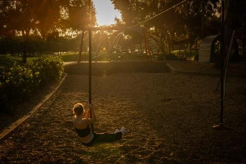 Sunset Serenity on a Swing Stock Photos