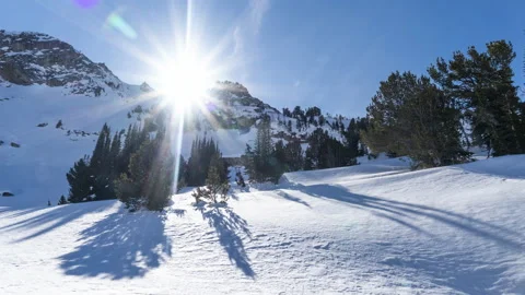 Sunset set below snow rocky mountain ridge Stock Footage 167052326