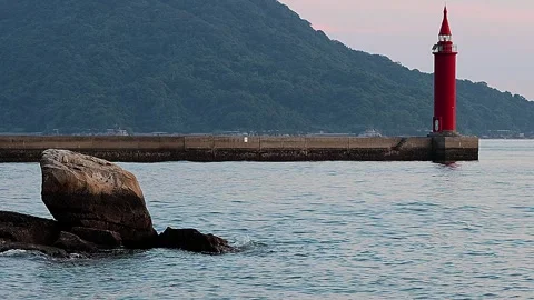Sunset Seto Inland Sea &amp; Lighted Lighthouse Landscape,4K Stock Footage 342963475