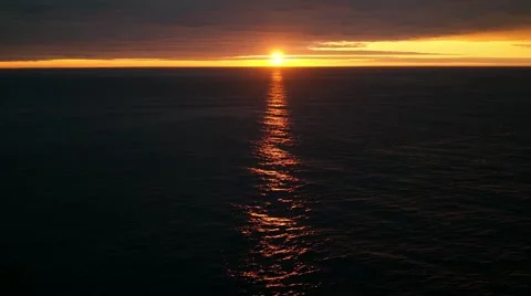 The sunset setting over the ocean  스톡 동영상 56904382