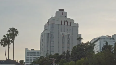 Sunset setting over the Sunset Tower on the Sunset Strip Video stock 130844655