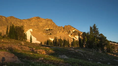 Sunset shadow moving across mountains Stock Footage 167344124